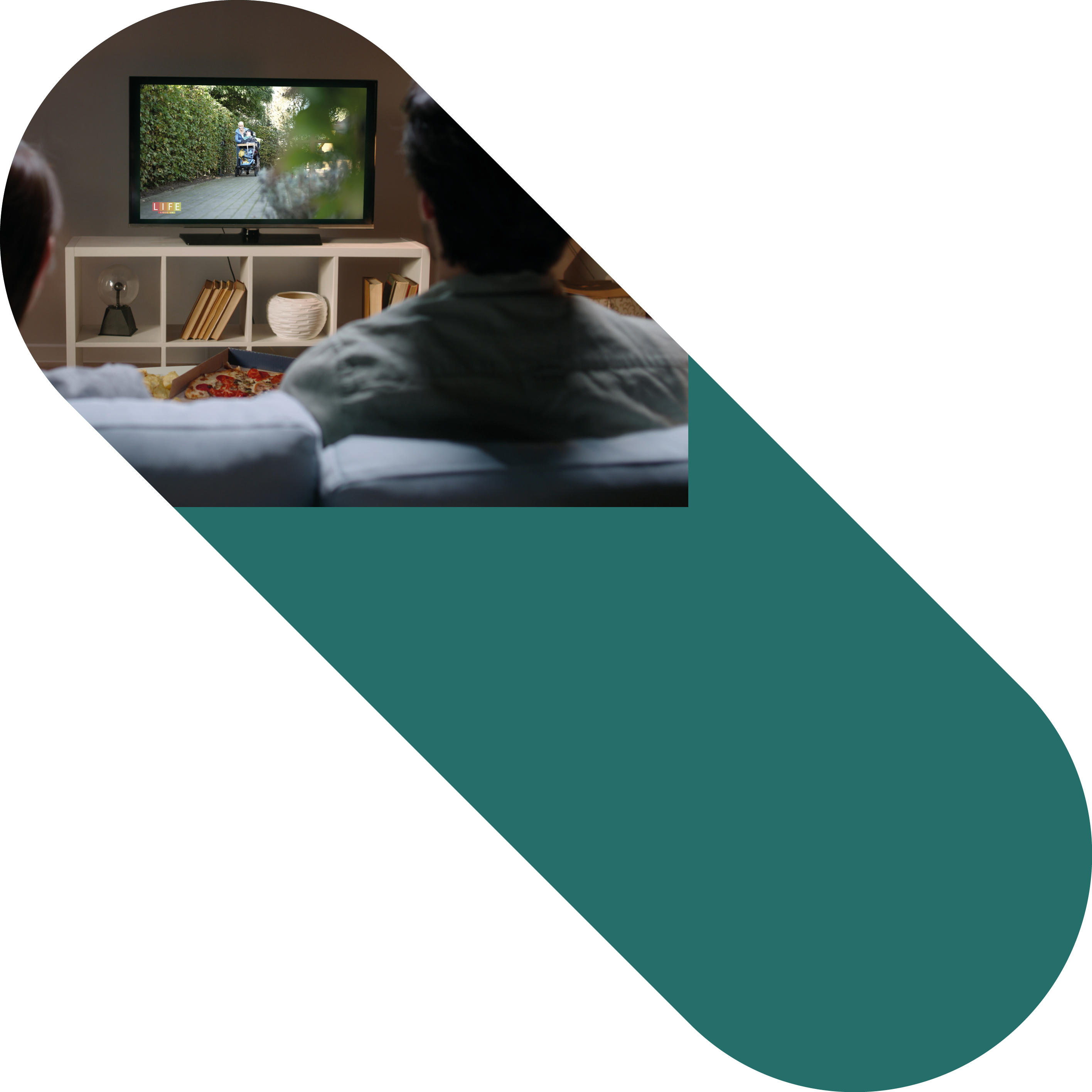 Unrecognizable couple sitting together on couch at home, watching tv shows with chroma-key green screen and eating unhealthy food . High quality photo